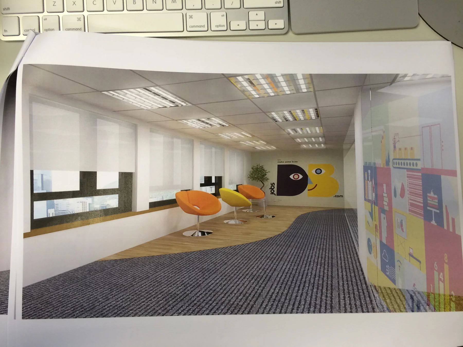 Photograph of a printed jobsDB office visualisation showing lounge seating and wall decoration